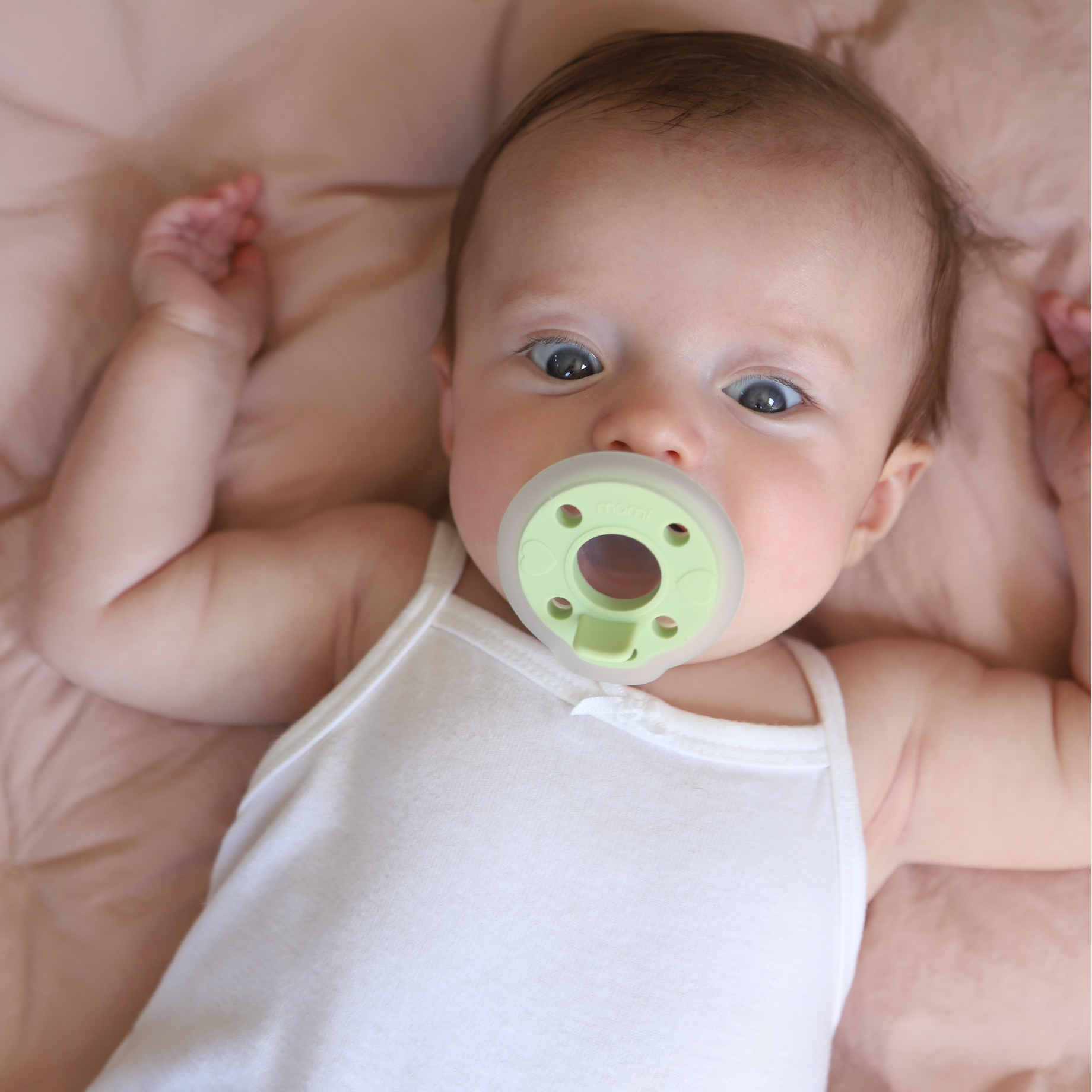 mōmi babypace® pacifiers in multiple vibrant colors