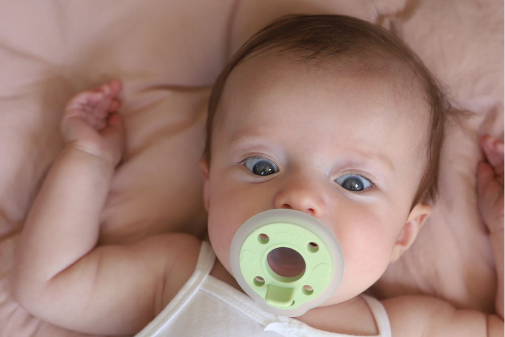 offer baby a pacifier in a moment that's calm for easy introduction