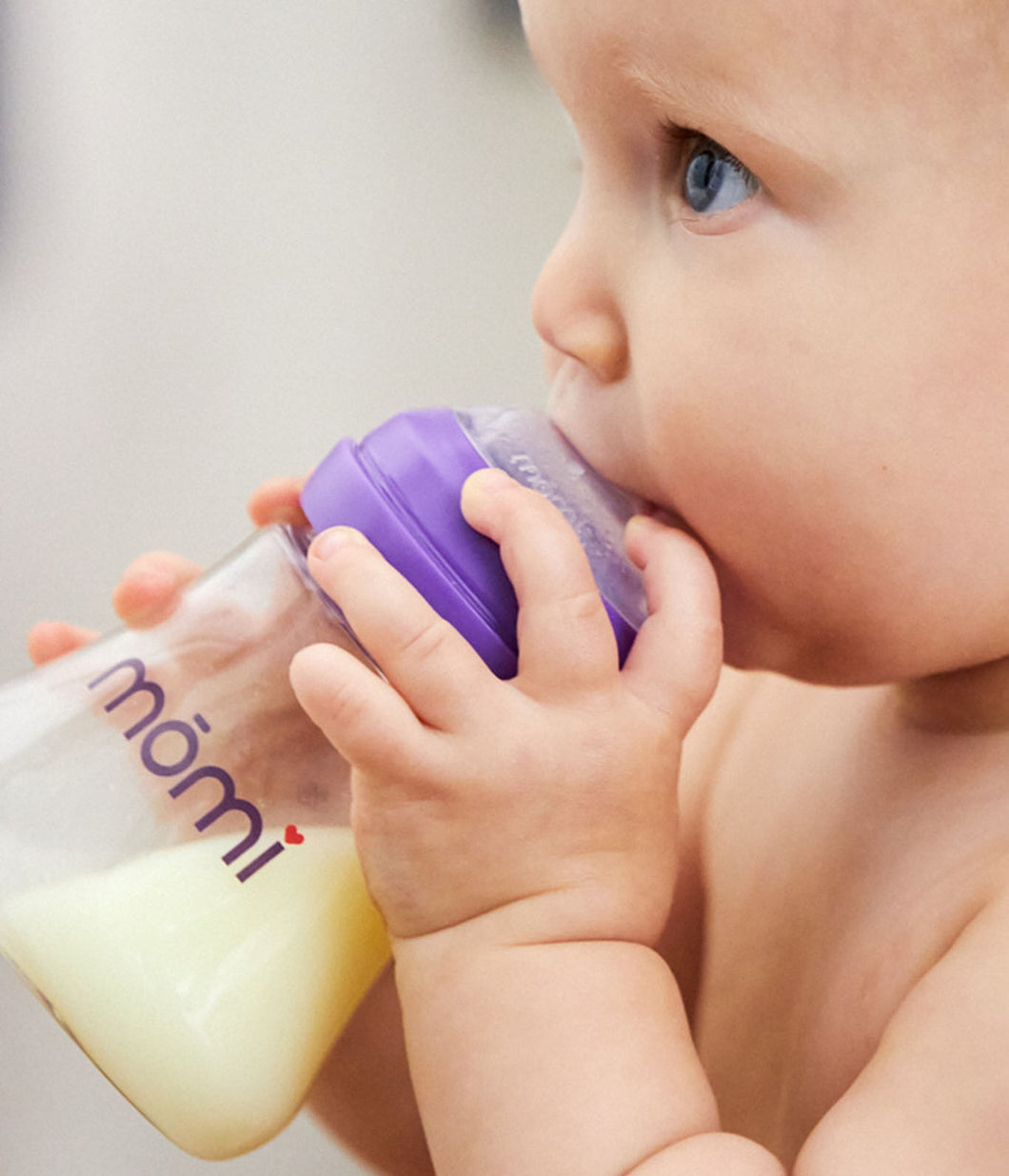 Close-up image of Baby feeding from a Momi Bottle