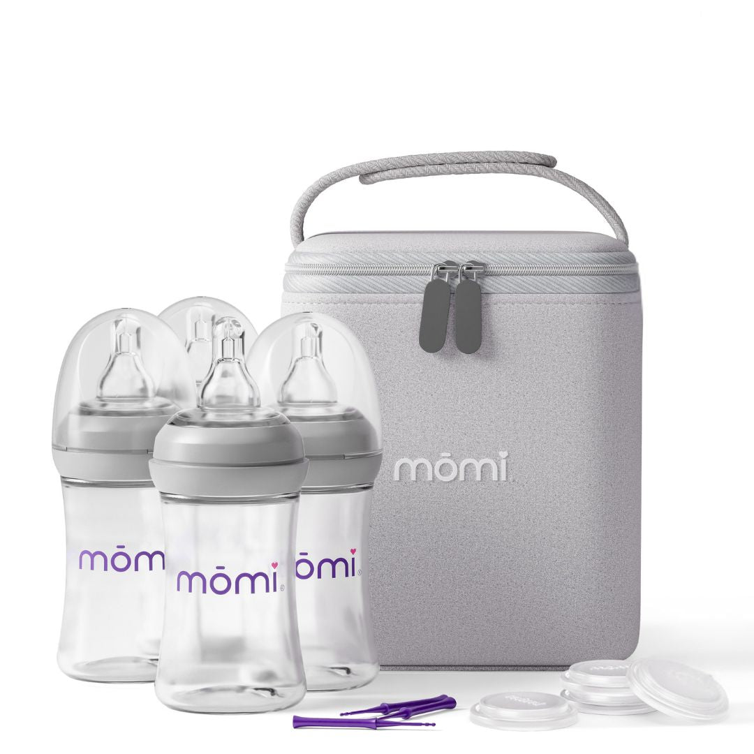 mōmi breast-like bottle set with gray breastmilk cooler bag and cleaning brush on a white background